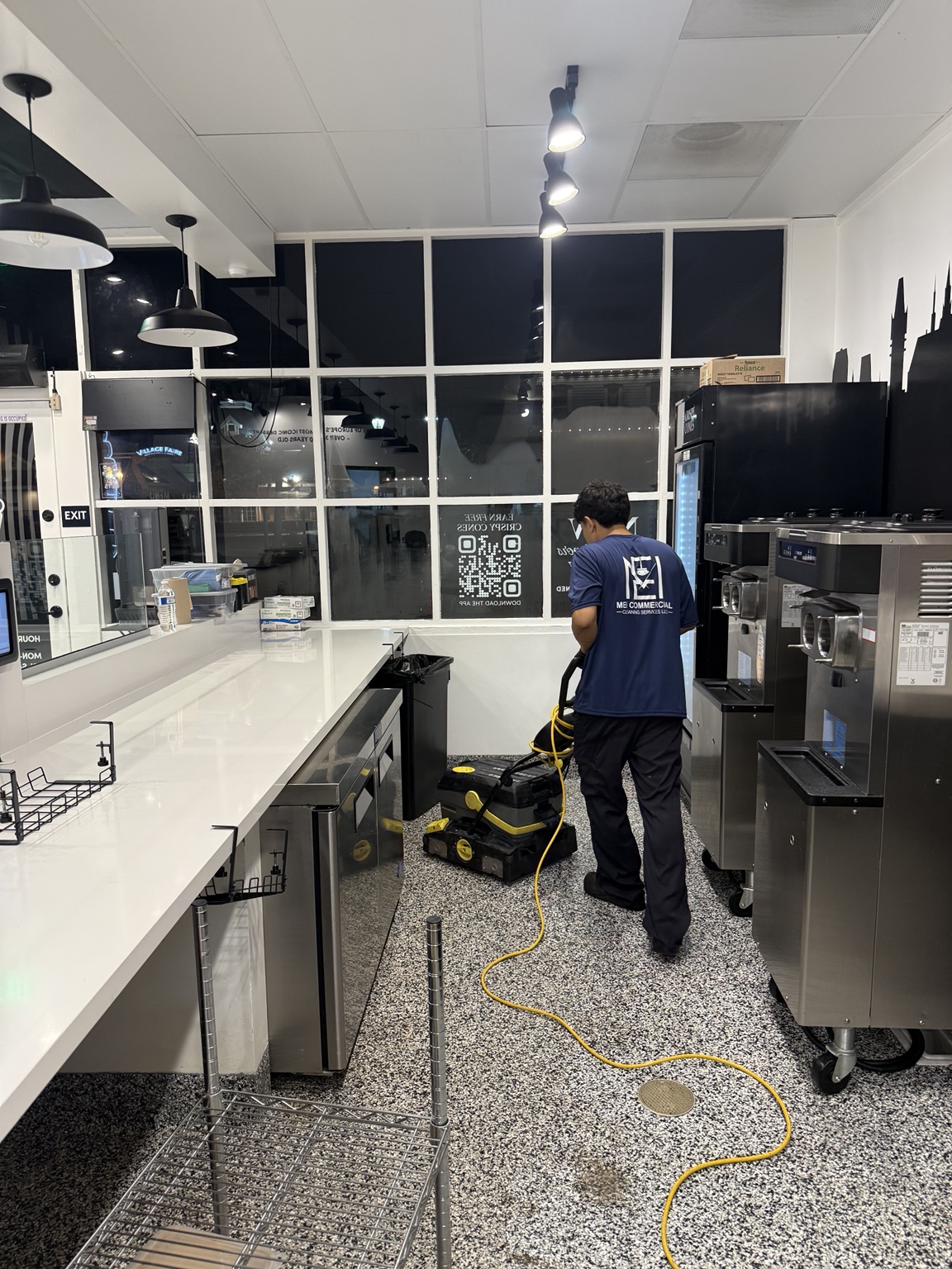MEI team member operating floor-cleaning equipment